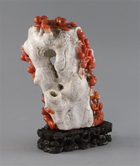 A Chinese chalcedony vase, in imitation of coral, H. 19.5cm, carved wood stand